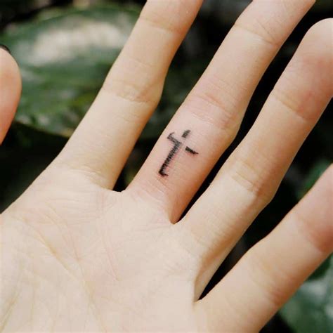 small fingers crossed tattoo|pictures of cross tattoos women.